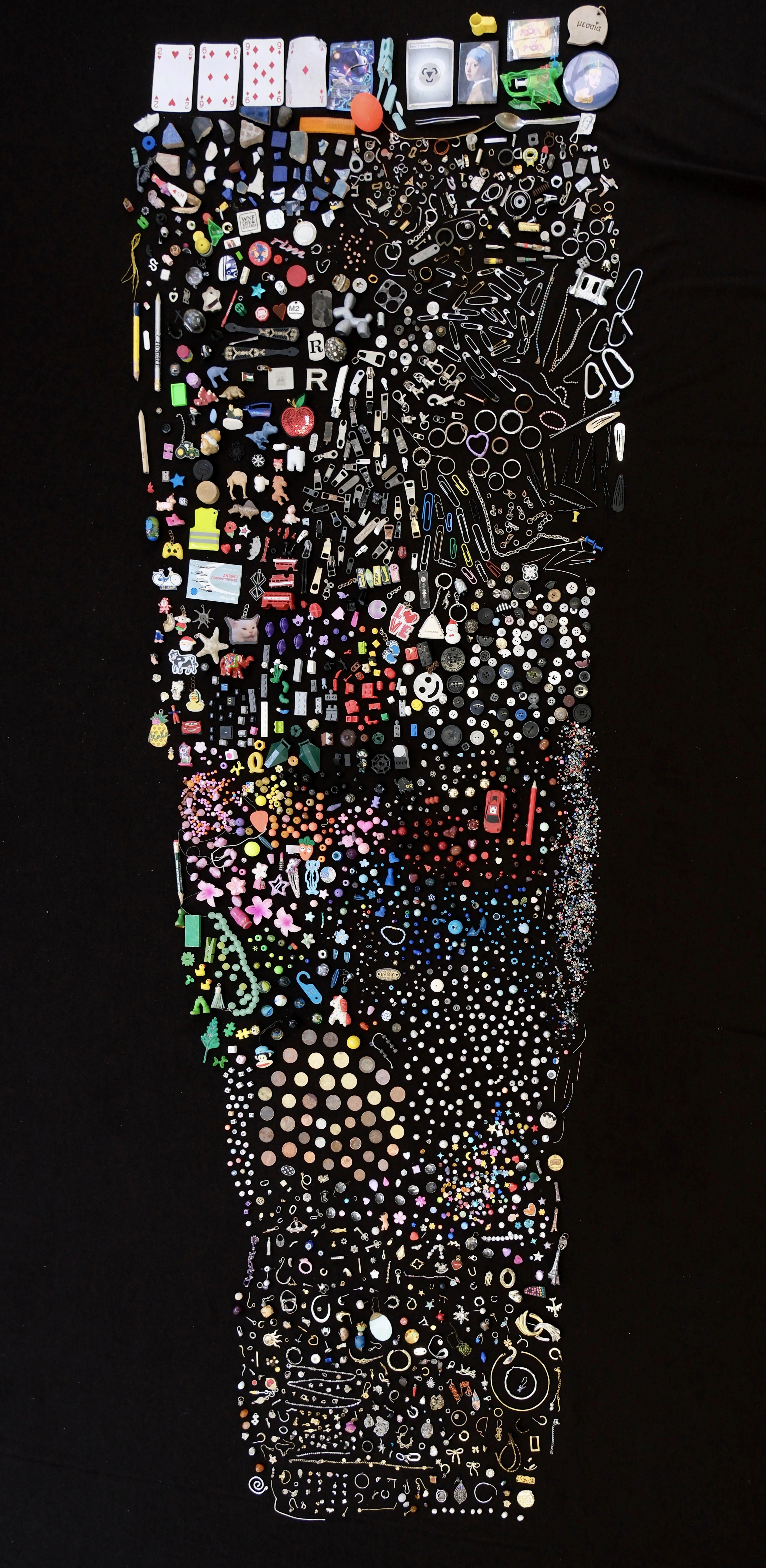Until Found archive of street-found objects arranged on black fabric